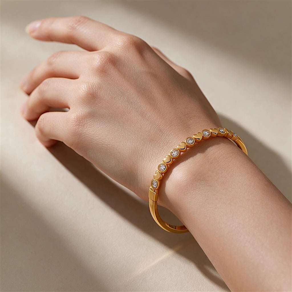 Bangle showing alternating heart and sparkling details