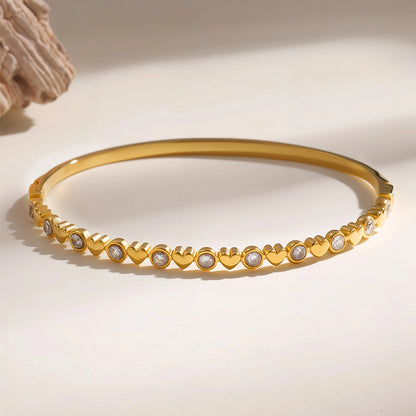 Heart bangle resting on a light surface