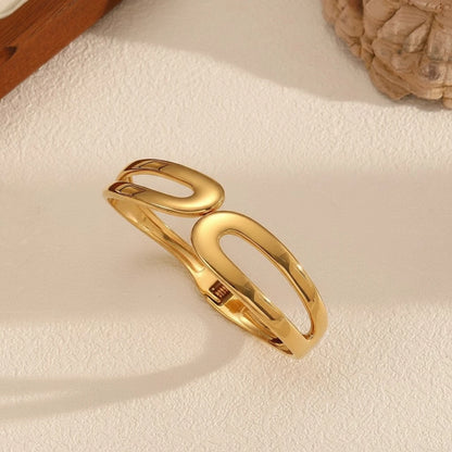 The “Lyra” Sculptural Infinity Cutout Bangle