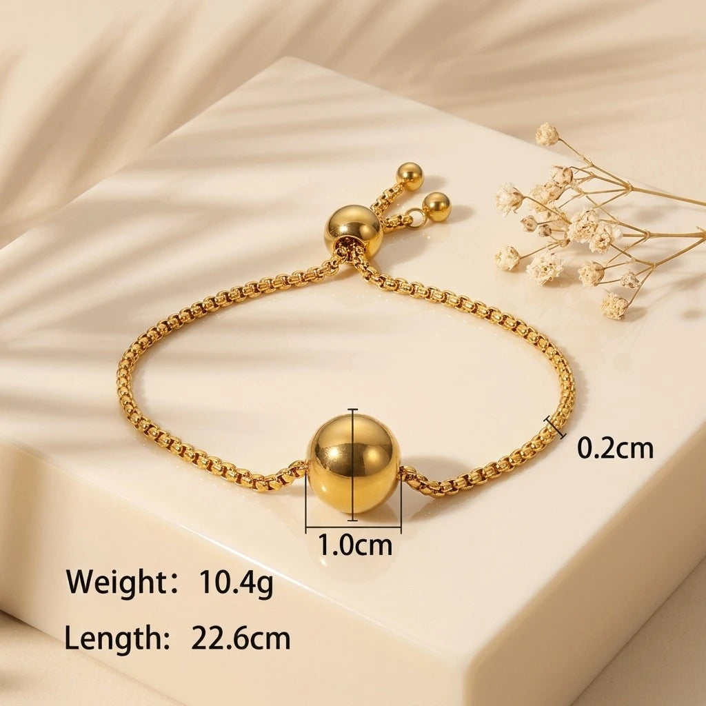 The Orbit Gold Sphere Slider Bracelet — spec flat lay showing weight 10.4g, length 22.6cm, sphere diameter 1.0cm, chain width 0.2cm