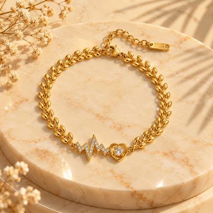 Gold-tone leaf-link bracelet with sparkling heartbeat and heart charms