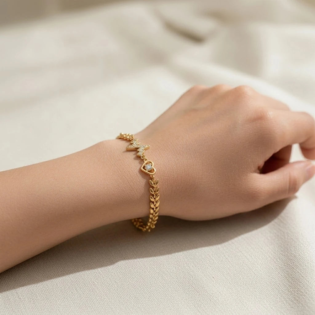 Close-up of heartbeat and heart charms on the bracelet