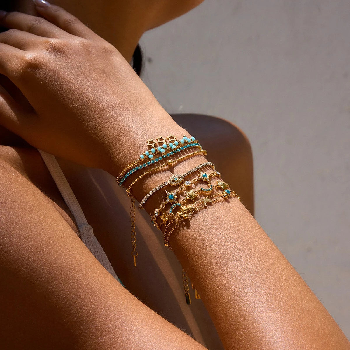 Blue and gold-tone double-row bracelet with lobster clasp