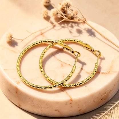 The Solaria Diamond-Cut Textured Hoops