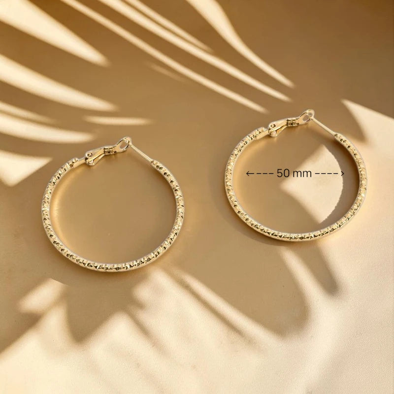 The Solaria Diamond-Cut Textured Hoops
